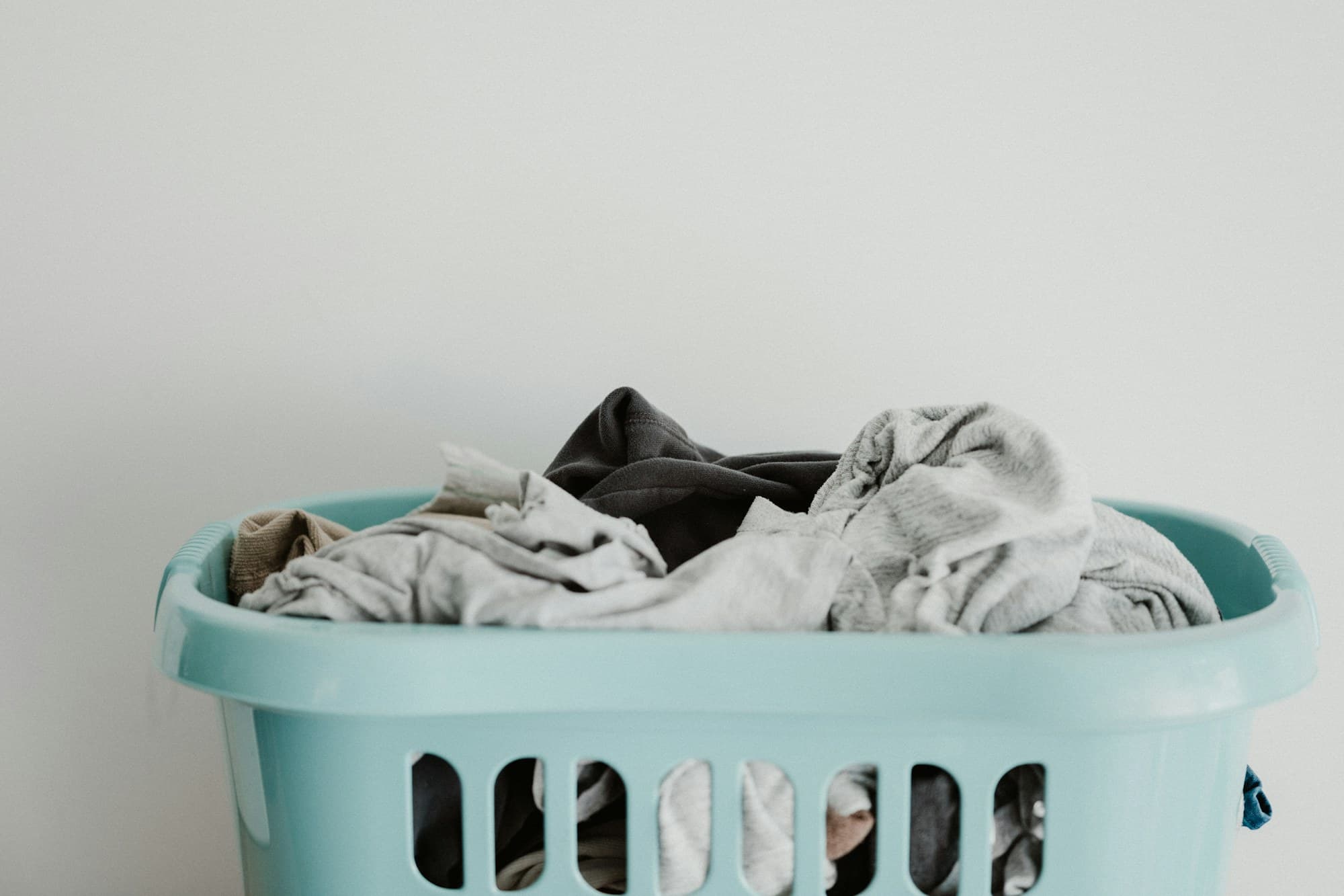 A full laundry basket waiting to be collected