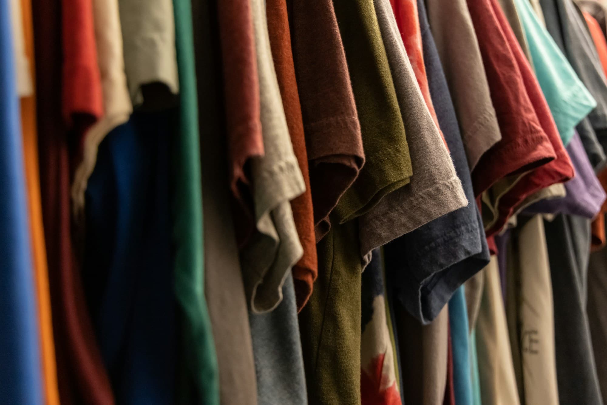 Colourful clothing in a laundry pile